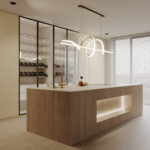 Keuken in warme, bruine kleurschakering en levendige nerf van notenhout in decor LS40. Deze is verrassend gecombineerd met de voelbare lijnenstructuur Riga van Cleaf.