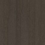 Detailafbeelding van decoratief plaatmateriaal met een dynamisch lijnenspel in een donkerbruin eikenhout decor, de S218 Doga van Cleaf.